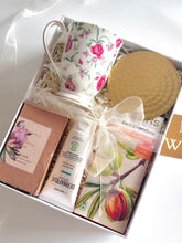 Load image into Gallery viewer, Close up of a luxury ceramic mug and hammered brass coaster, from Grande Gift Hampers.